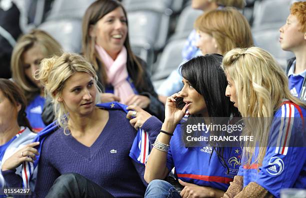 The wife of French defender Eric Abidal and the wife of French midfielder Franck Ribery speak with Samir Nasri girlfriend, Tatiana Golovin before the...