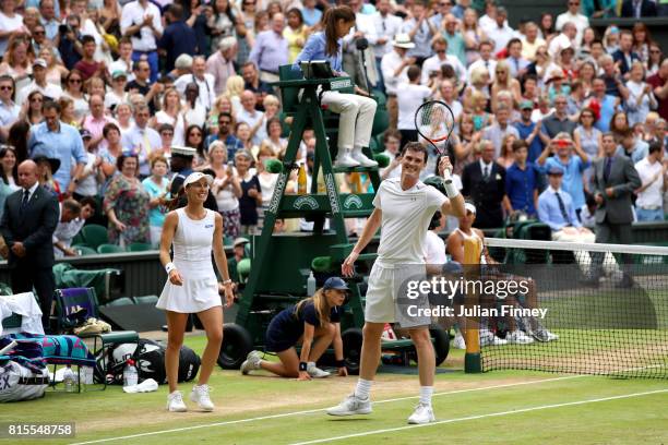 Jamie Murray of Great Britain and partner Martina Hingis of Switzerland celebrate victory after the Mixed Doubles final match against Heather Watson...