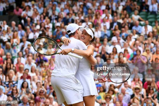 Jamie Murray of Great Britain and partner Martina Hingis of Switzerland celebrate championship point and victory during the Mixed Doubles final match...