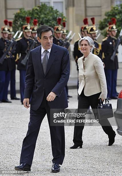 French Prime Minister Francois Fillon arrives with his wife Penelope to attend a private dinner for US President George W. Bush at the presidential...