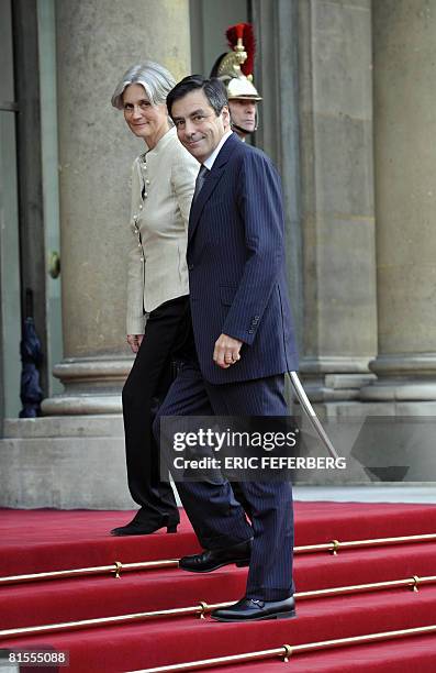 French Prime Minister Francois Fillon arrives with his wife Penelope to attend a private dinner for US President George W. Bush at the presidential...