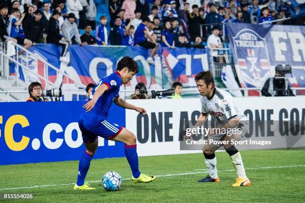 Suwon Defender Yang Sangmin in action against Kawasaki Midfielder Tasaka Yusuke during the AFC Champions League 2017 Group G match between Suwon...