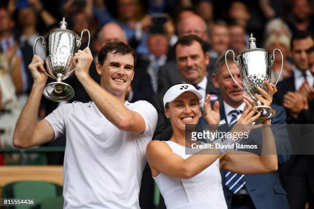 Jamie Murray of Great Britain and Martina Hingis of Switzerland celebrate victory with their trophies after the Mixed Doubles final match against...