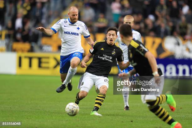 Daniel Sjolund of IFK Norrkoping and Stefan Ishizaki of AIK during the Allsvenskan match between AIK and IFK Norrkoping at Friends arena on July 16,...