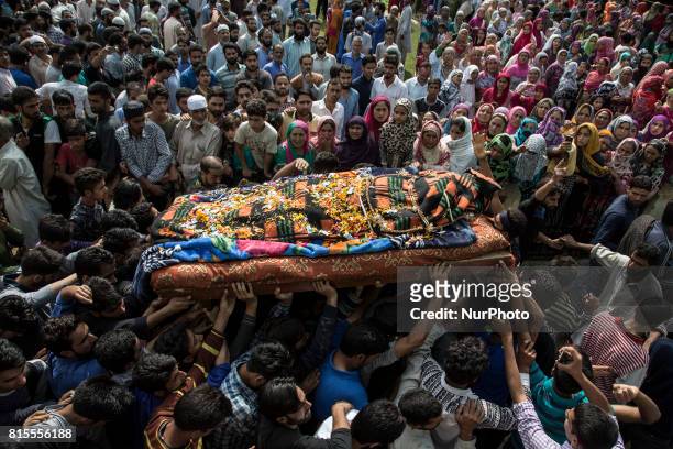 Kashmiri villagers carry the body of a local rebel Parvaiz Mir during his funeral procession, Sunday, July 16 in Pohoo village 38 kilometers south of...
