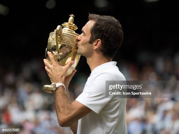 Roger Federer poses with the trophy after winning men's singles title during the Wimbledon Championships at the All England Lawn Tennis and Croquet...