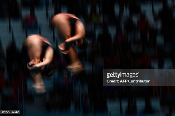Mexico's Gabriela Agundez Garcia and Mexico's Samantha Jimenez Santos compete in the women's 10m platform synchro final during the diving competition...