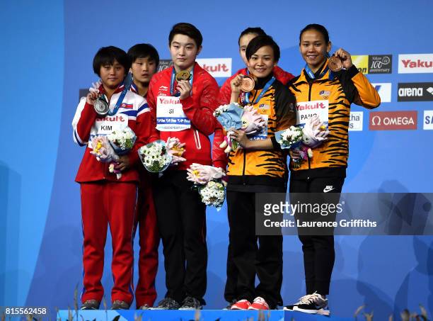 Silver medalists Rae Kim Mi and Kuk Hyang Kim of The Democratic People's Republic of Korea, gold medalists Qian Ren and Yajie Si of China and bronze...