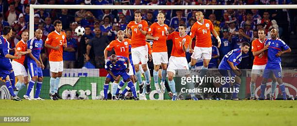 French midfielder Franck Ribery takes a shot as French and Dutch players react during the Euro 2008 Championships Group C football match Netherlands...