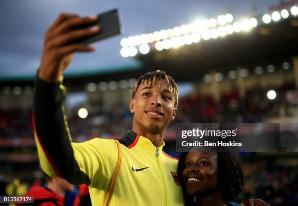 Leo Neugebauer of Germany poses for a selfie with a fan on day five of the IAAF U18 World Championships at The Kasarani Stadium on July 16, 2017 in...