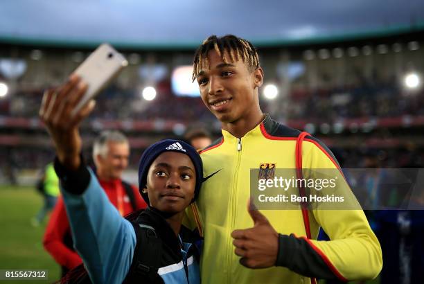 Leo Neugebauer of Germany poses for a selfie with a fan on day five of the IAAF U18 World Championships at The Kasarani Stadium on July 16, 2017 in...