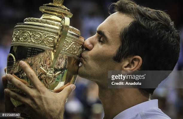 Roger Federer of Switzerland celebrates with the winner's trophy after beating Marin Cilic of Croatia in the men's final of the 2017 Wimbledon...