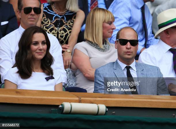 Prince William of Great Britain and his wife Katherine watch Roger Federer of Switzerland in action against Marin Cilic of Croatia from the royal box...