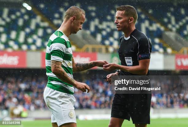 Belfast , United Kingdom - 14 July 2017; Leigh Griffiths of Celtic hands over missiles thrown at him during the UEFA Champions League Second...