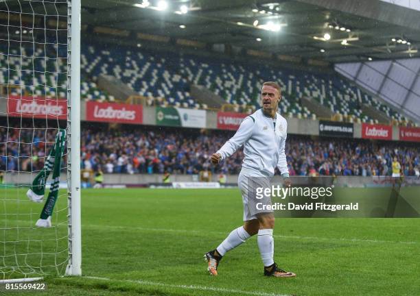 Belfast , United Kingdom - 14 July 2017; Leigh Griffiths of Celtic ties a Celtic scarf around the goalpost following the UEFA Champions League Second...
