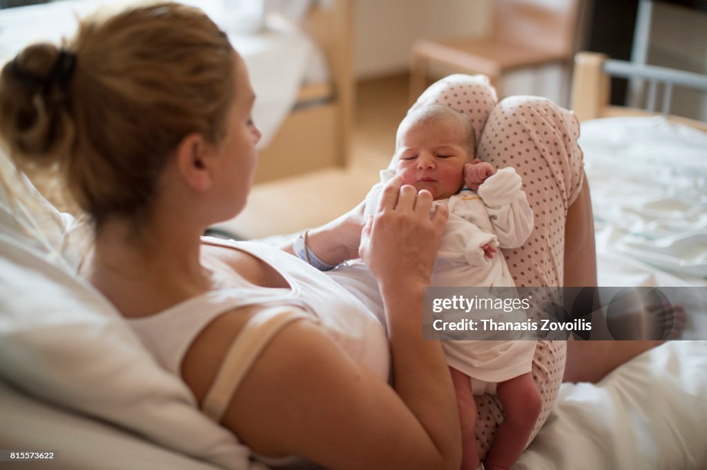 Mother with her newborn baby in the hospital