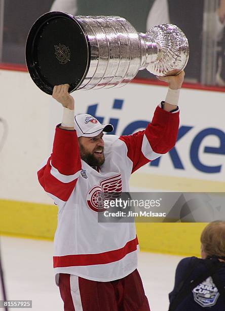 Tomas Holstrom of the Detroit Red Wings celebrates with the Stanley Cup after defeating the Pittsburgh Penguins in game six of the 2008 NHL Stanley...
