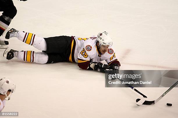 Brett Sterling of the Chicago Wolves slides on the ice reaching for the puck against the Wilkes-Barre/Scranton Penguins during the Calder Cup Finals...