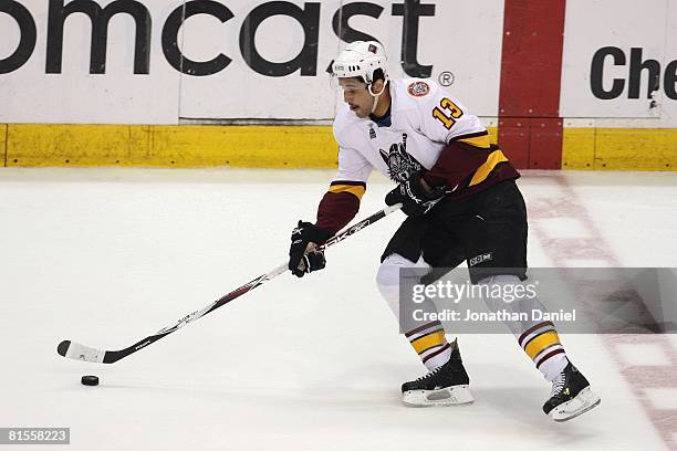 Andre Deveaux of the Chicago Wolves controls the puck against the Wilkes-Barre/Scranton Penguins during the Calder Cup Finals on June 10, 2008 at the...