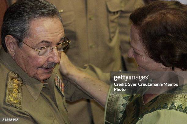 Cuba's President Raul Castro talks with Aleida March, widow of Ernesto Che Guevara, after a concert celebrating the 80th birthday of Che in the Karl...