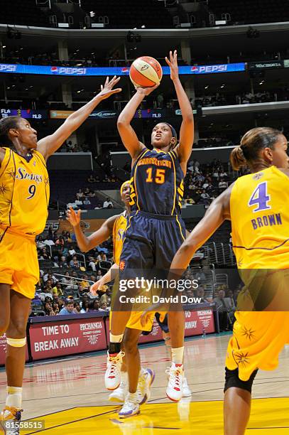 Asjha Jones of the Connecticut Sun shoots against Lisa Leslie of the Los Angeles Sparks at Staples Center on June 13, 2008 in Los Angeles,...