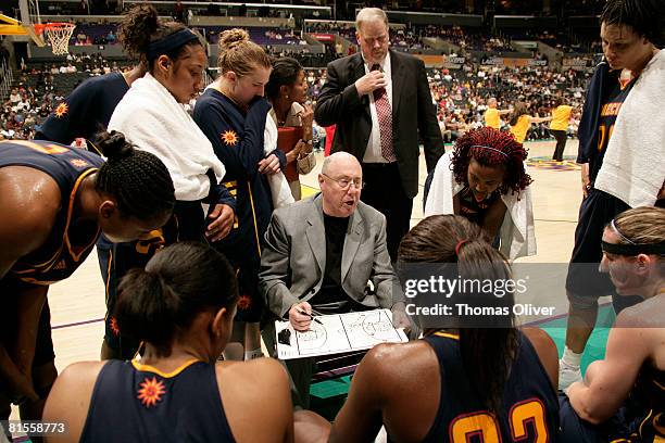 The Connecticut Sun huddle around head coach Mike Thibault during a timeout against the Los Angeles Sparks at Staples Center on June 13, 2008 in Los...
