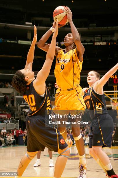 Lisa Leslie of the Los Angeles Sparks shoots over Tamika Whitmore of the Connecticut Sun at Staples Center on June 13, 2008 in Los Angeles,...