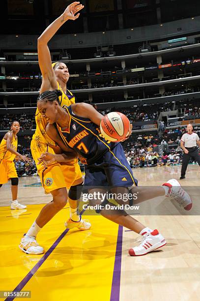 Sandrine Gruda of the Connecticut Sun drives along the baseline against Candace Parker of the Los Angeles Sparks at Staples Center on June 13, 2008...