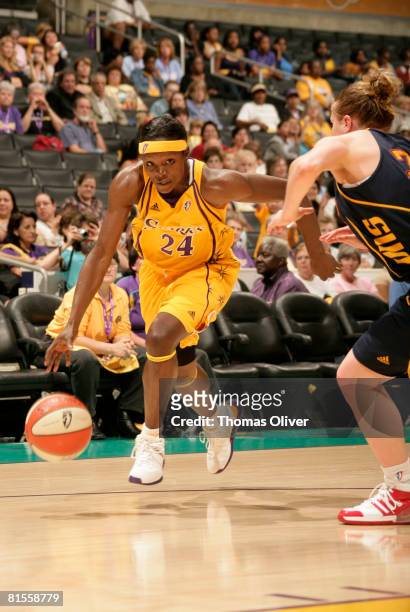 Marie Ferdinand-Harris of the Los Angeles Sparks drives against the Connecticut Sun at Staples Center on June 13, 2008 in Los Angeles, California....