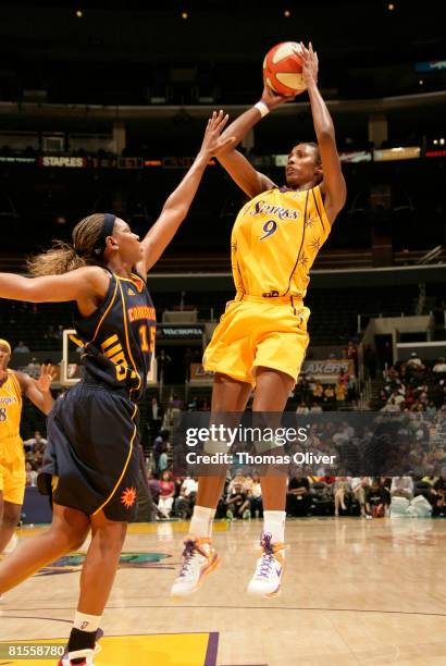 Lisa Leslie of the Los Angeles Sparks shoots over Asjha Jones of the Connecticut Sun during their game at Staples Center on June 13, 2008 in Los...