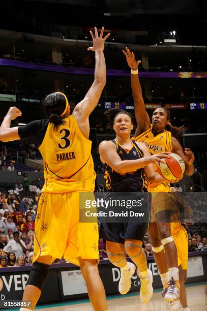 Tamika Whitmore of the Connecticut Sun goes up for a shot between Candace Parker and Lisa Leslie of the Los Angeles Sparks at Staples Center on June...