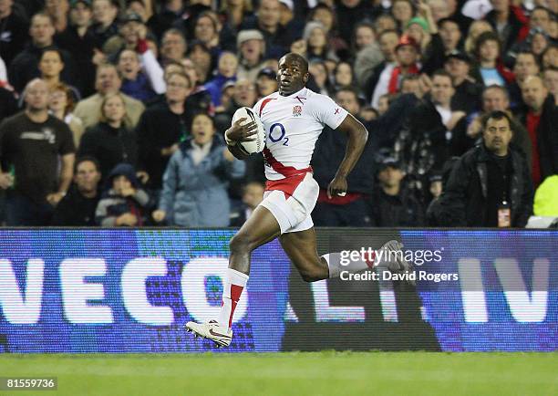 Topsy Ojo of England races away to score his first of two tries during the First Iveco Series Test match between the New Zealand All Blacks and...