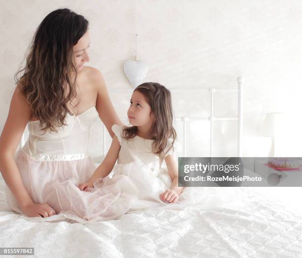 mother and daughter love - meisje stock-fotos und bilder