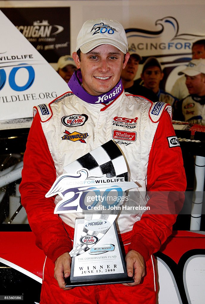 Justin Lofton driver of the Lofton Cattle Dodge holds the trophy ...