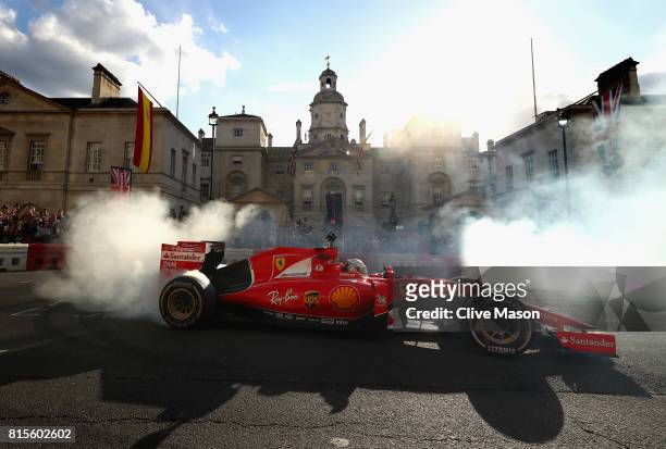 Sebastian Vettel of Germany and Ferrari driving the Scuderia Ferrari SF15-T during F1 Live London at Trafalgar Square on July 12, 2017 in London,...