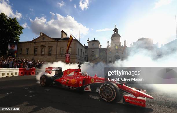 Sebastian Vettel of Germany and Ferrari driving the Scuderia Ferrari SF15-T during F1 Live London at Trafalgar Square on July 12, 2017 in London,...