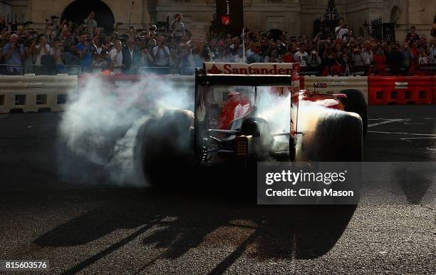 Sebastian Vettel of Germany and Ferrari driving the Scuderia Ferrari SF15-T during F1 Live London at Trafalgar Square on July 12, 2017 in London,...