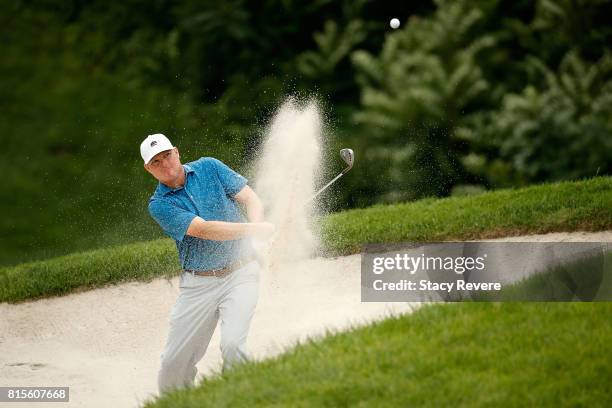 Chad Campbell hits from a green side bunker on the sixth hole during the final round of the John Deere Classic at TPC Deere Run on July 16, 2017 in...