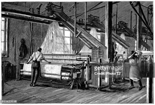 Weaving shed fitted with Jacquard power looms. Swags of punched cards carrying pattern being woven are at right and above each loom. Illustration...
