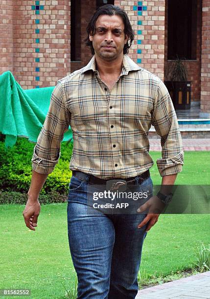 Pakistan fast bowler Shoaib Akhtar arrives for a case hearing at the Cricket Academy in Lahore on June 14, 2008. An appeal tribunal June 12 reduced...