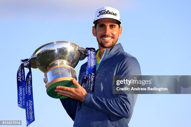 Rafa Cabrera-Bello of Spain poses with the trophy following his victory on the 1st play off hole during the final round of the AAM Scottish Open at...