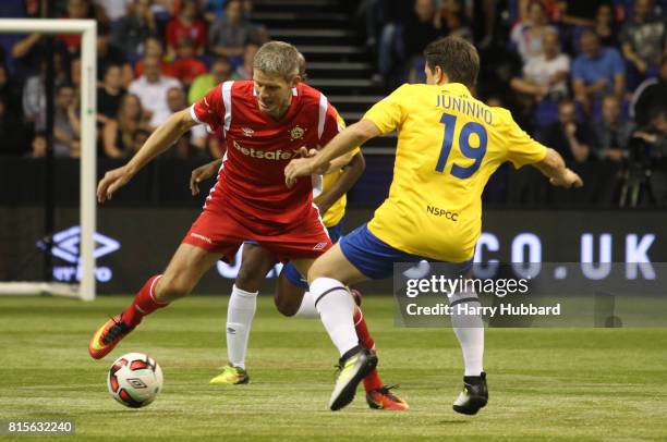 Juninho Paulista of Brazil and Chris Sorensen of Denmark in action during the Semi-Final Star Sixes match between Brazil and Denmark at The O2 Arena...