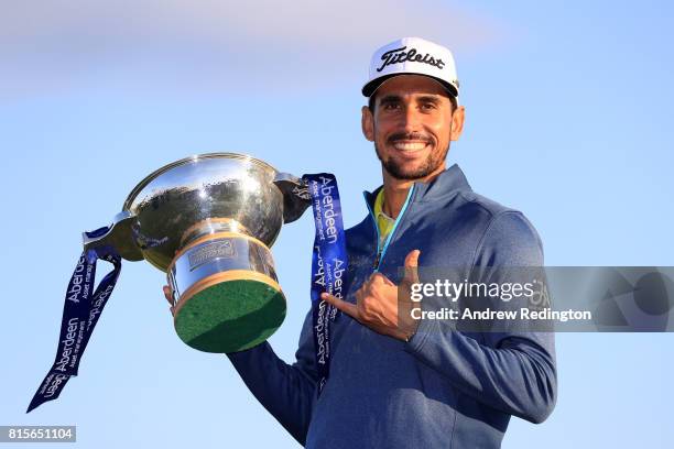 Rafa Cabrera-Bello of Spain poses with the trophy following his victory on the 1st play off hole during the final round of the AAM Scottish Open at...