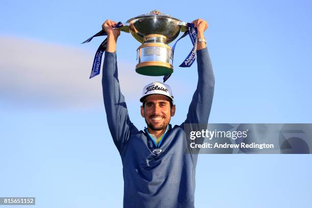 Rafa Cabrera-Bello of Spain poses with the trophy following his victory on the 1st play off hole during the final round of the AAM Scottish Open at...