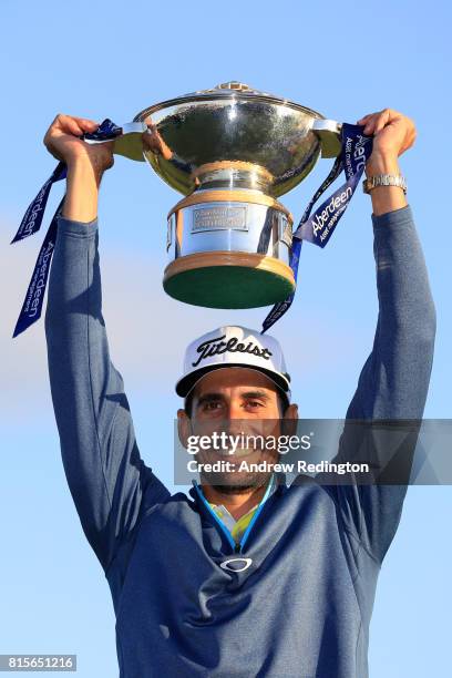 Rafa Cabrera-Bello of Spain poses with the trophy following his victory on the 1st play off hole during the final round of the AAM Scottish Open at...