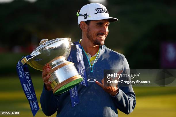 Rafa Cabrera-Bello of Spain poses with the trophy following his victory on the 1st play off hole during the final round of the AAM Scottish Open at...