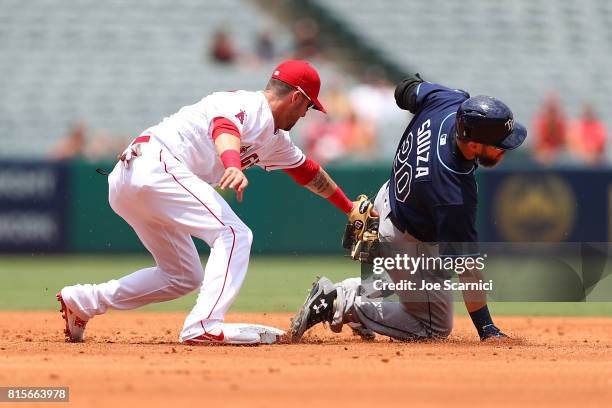 Nick Franklin of the Los Angeles Angels tags out Steven Souza Jr. #20 of the Tampa Bay Rays at second base in the second inning at Angel Stadium of...