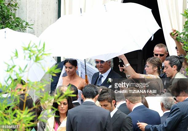 Renault F1 boss Flavio Briatore and his bride, top model Elisabetta Gregoraci, leave the church of Santo Spirito in Sassia in Rome on June 14, 2008...