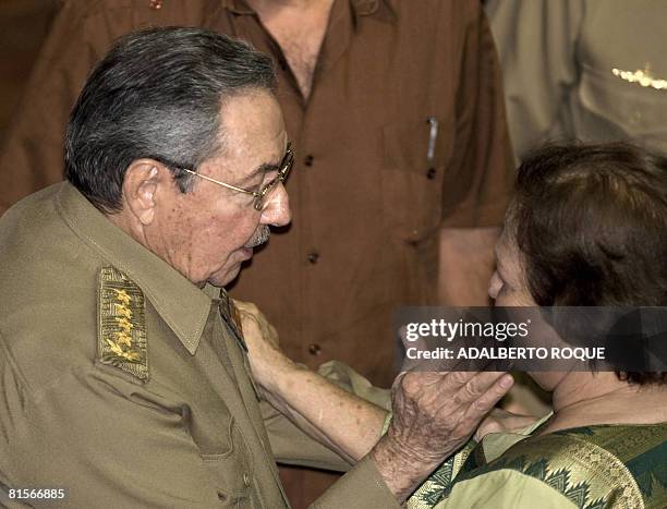 Cuban President Raul Castro greets the widow of Ernesto "Che" Guevara, Aleida Guevara March, in Havana on June 13, 2008 during a cultural gala for...