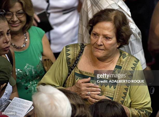 The widow of Ernesto "Che" Guevara, Aleida Guevara March talks with friends at the Karl Marx theatre in Havana on June 13, 2008 during a cultural...
